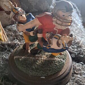 House of Lloyd Christmas Around The World "Tackling the Holidays" figurine.  It